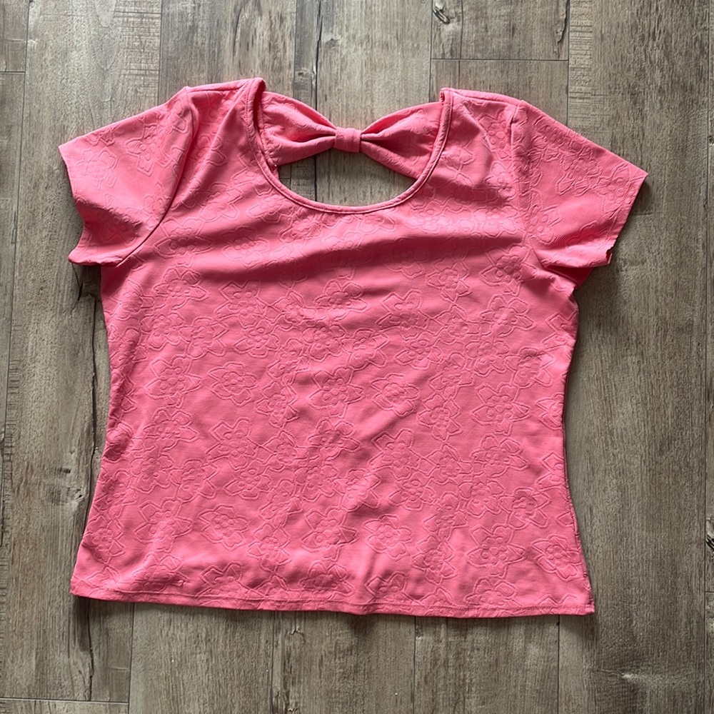 Woman’s blouse salmon color. No tags but size is XL
